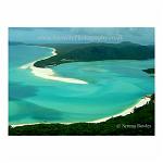 Aerial view, looking down onto the fine white sand of Whitehaven Beach, surrounded by crystal clear water. The Whitsundays, Australia.